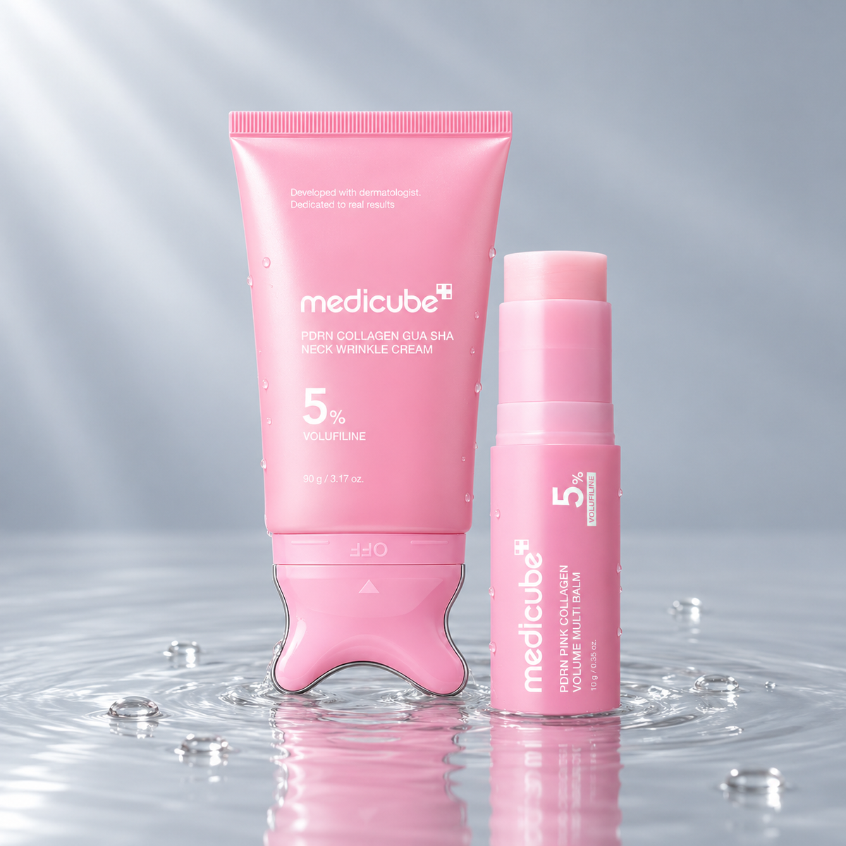 Medicube PDRN Collagen Gua Sha Neck Cream and Volume Multi Balm stick standing in clear water on a light grey studio background