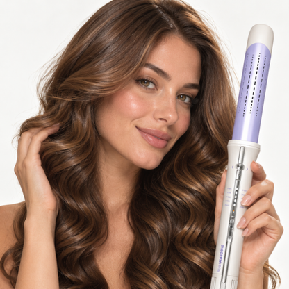 Smiling woman with wavy hair holding the SHEGLAM HAIR One Touch Airflow Styler Pro 32mm