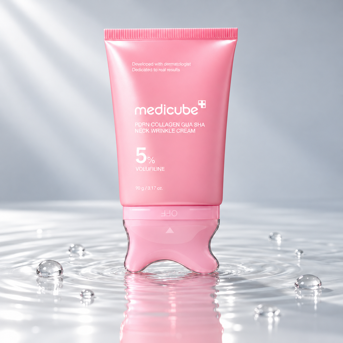 Medicube PDRN Collagen Gua Sha Neck Wrinkle Cream tube standing in clear water on a light grey studio background