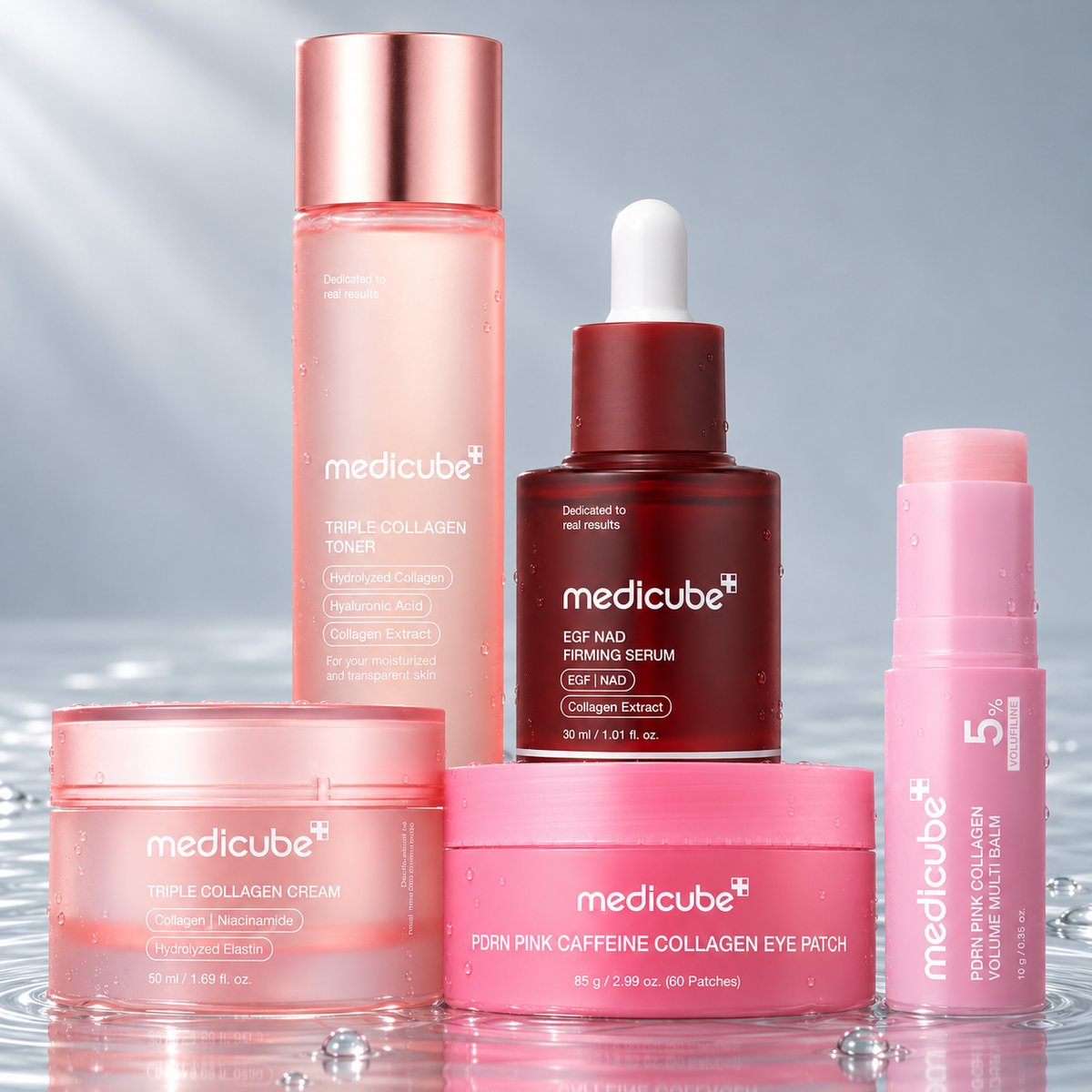 Medicube toner, EGF NAD serum, triple collagen cream, eye patches and multi balm standing in clear water