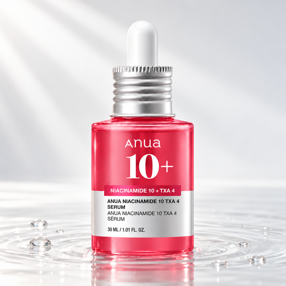 Anua Niacinamide 10 + TXA 4 Serum dropper bottle standing in clear water on a light studio background