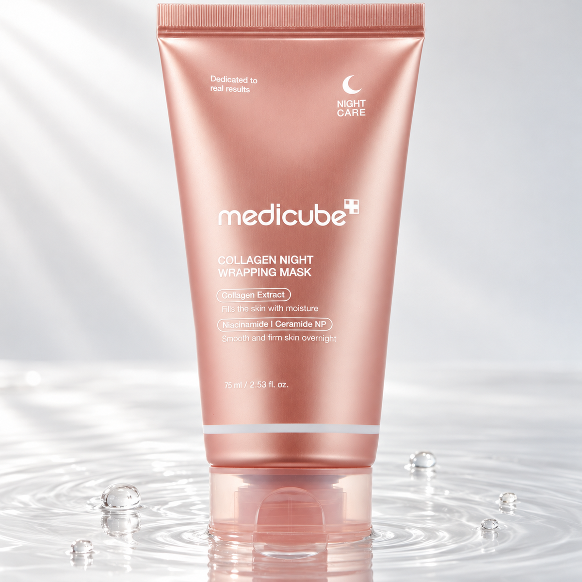 Medicube Collagen Night Wrapping Mask tube standing in clear water on a light studio background