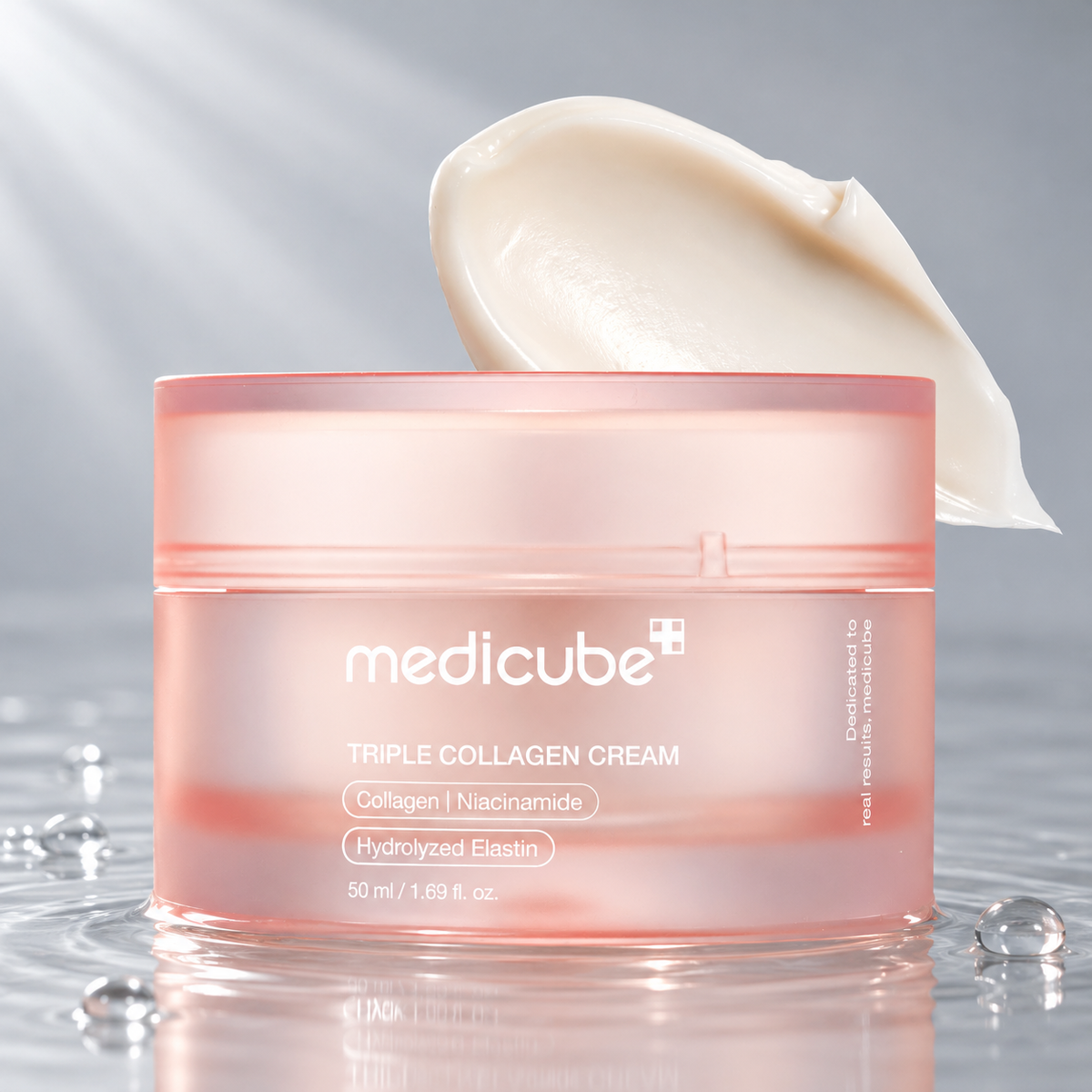 Medicube Triple Collagen Cream jar standing in clear water on a light grey studio background