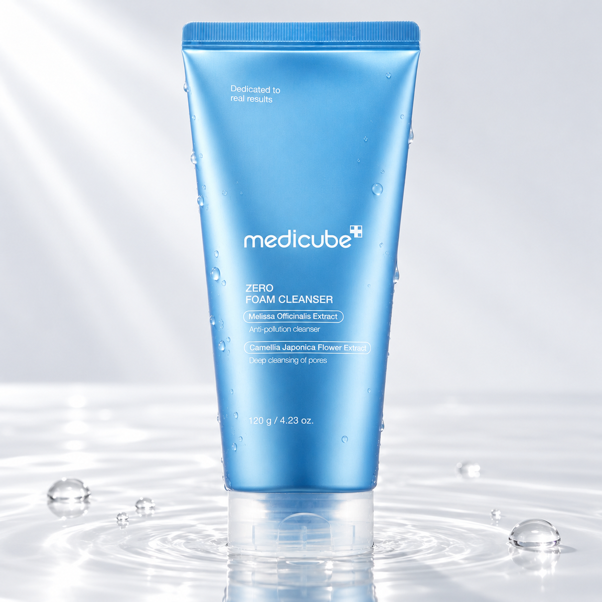 Medicube Zero Foam Cleanser tube standing in clear water on a light studio background